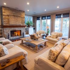 Transitional Living Room With Stacked-Stone Fireplace