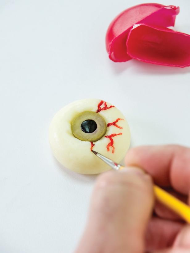 Painting Veins With Food Coloring on Cheesy Halloween Appetizer