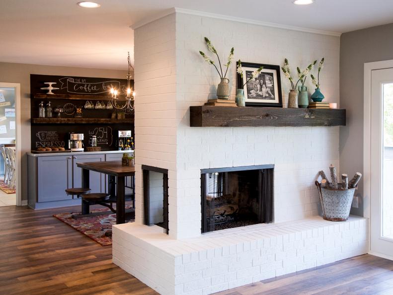 White Brick Fireplace With Wood Mantel