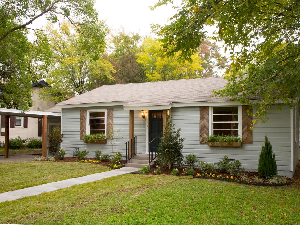 Soft Blue Cottage House With Wooden Shutters Hgtv
