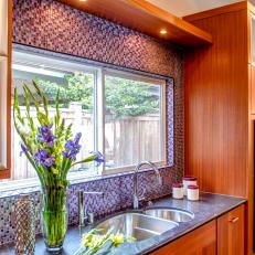 Contemporary Kitchen With Multicolored Mosaic-Tile Accent Wall