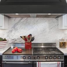 Gourmet Kitchen Range With White Marble Backsplash