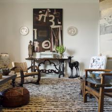 Large Area Rug Adds Warmth to White, Eclectic Living Room