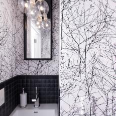 Black and White Powder Room With Bold Wallpaper