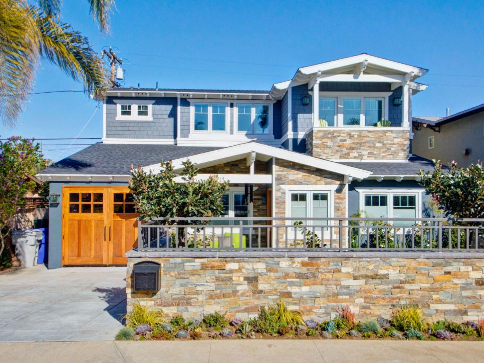 Eclectic, Blue Beach House Exterior With Stacked Stone Wall