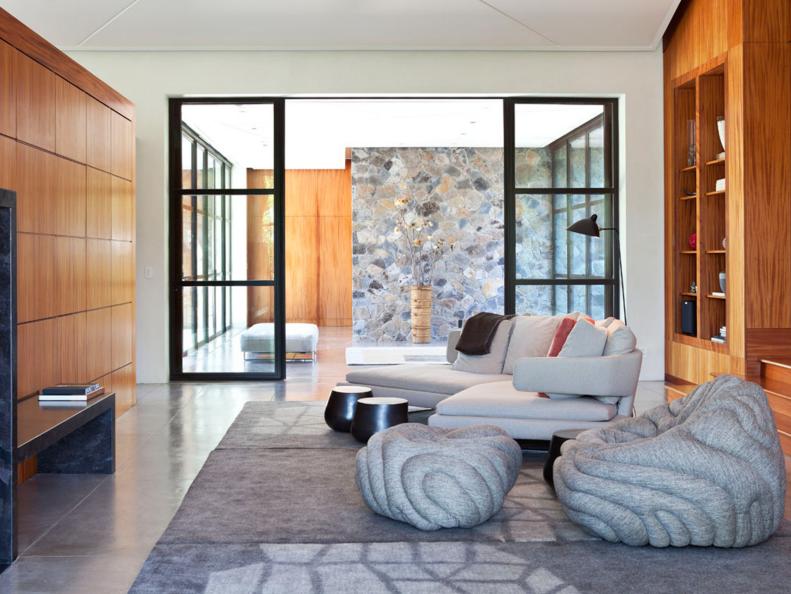 Contemporary Living Room With Stone Wall