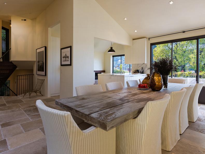 Transitional Dining Room With Rustic Table