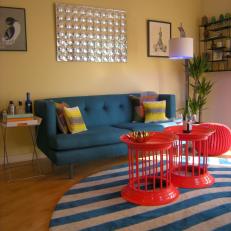 Solid Colored Furniture With Round Striped Area Rug