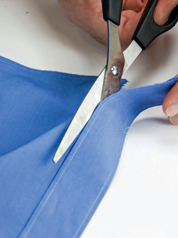 Remove the placket by cutting it away as close to the seam as possible.