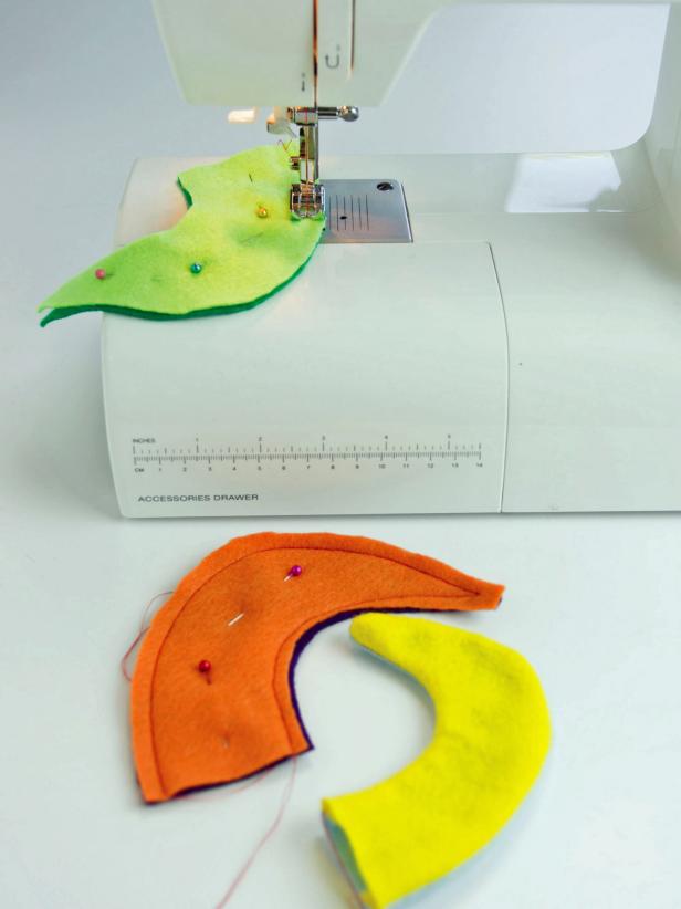 Sew two horn shapes together with colors you want next to each other on your hat.