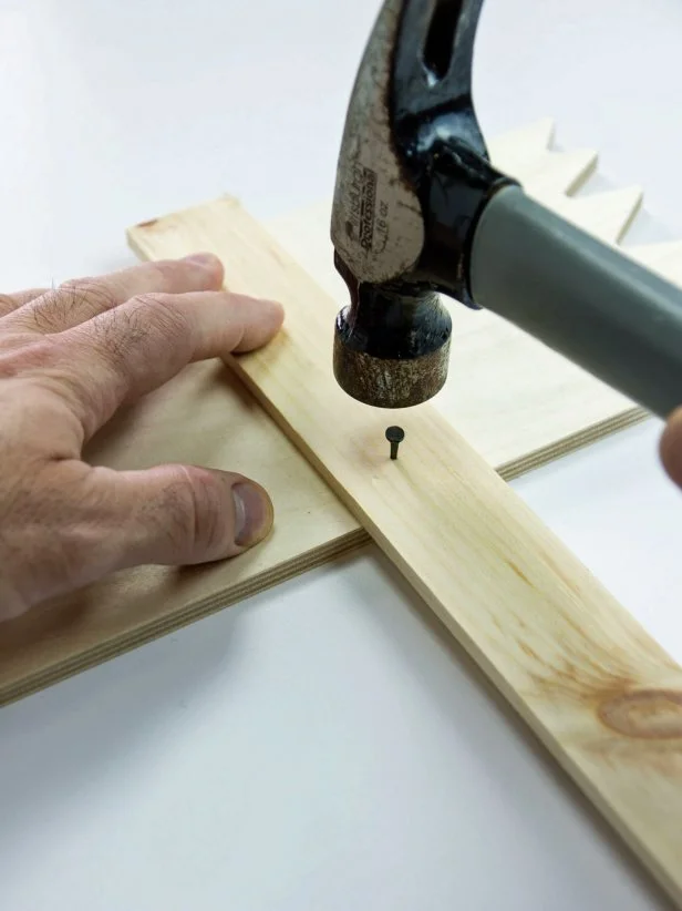 Repeat for the other side. Make the sign by attaching a craft wood sign to a sign holder with two small nails or brads.