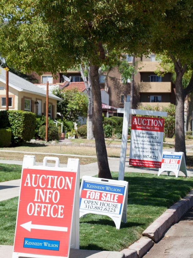 Open House and Auction Signs on Street Curb 