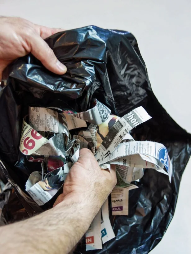 Stuff a black trash bag with shredded paper or fiber fill.