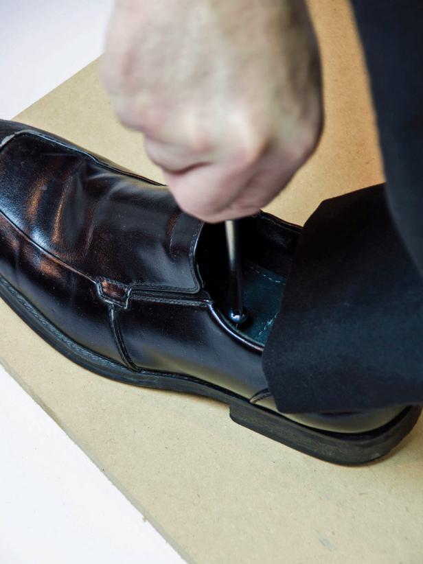 Add or remove filling to make it the right size. Attach the left shoe to the platform using a wood screw through the inside of the shoe and into the mdf platform.