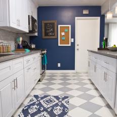 Gray-and-White Checkered Floor in Navy Kitchen