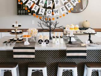Start with neutral decor like black and white party basics, cake stands and table runners, then add pops of color here and there. Wood, burlap and linen always work beautifully for fall celebrations, too.