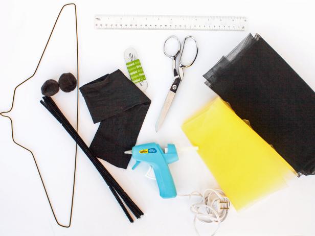 - Yellow Tulle
- Black Tulle
- 1/2" wide Elastic
- Scissors
- Black Pipe Cleaners
- Black Poms
- Wire Hanger
- Black Pantyhose