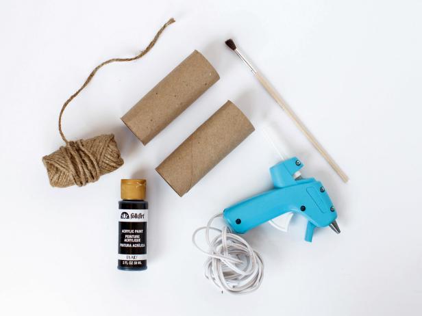 Paint two toilet paper rolls black or dark grey. Using hot glue, glue the two toilet papers rolls together at what will be the bridge of the nose. Punch a hole in the right and left side of the toilet paper roles and tie a length of jute twine to each side to hang around the child’s neck.