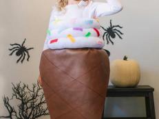 Your trick-or-treater will have a license to chill in this clever homemade costume that uses craft store supplies and white tights to transform them into a giant soft-serve cone.