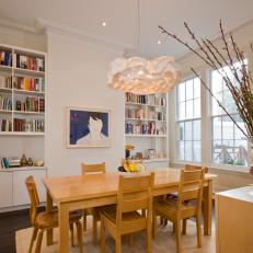 White Transitional Dining Room With Built-in Bookshelves