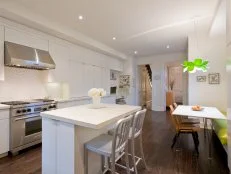 White kitchen with a breakfast nook. 