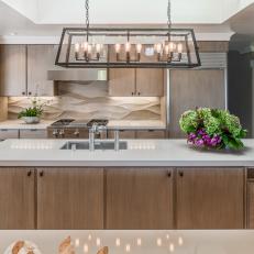 Elegant, Contemporary Kitchen With Light Cabinetry and Industrial Chandelier