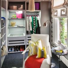 Eclectic Walk-In Closet With White Modern Armchair