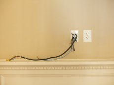 While demolition can be completed with basic do-it-yourself skills, wire management is much more difficult. If the existing wiring for a flat panel TV is properly centered over the fireplace, it’s best to leave it as-is, then design around it. Moving the electrical components is time-consuming, labor intensive and costly.