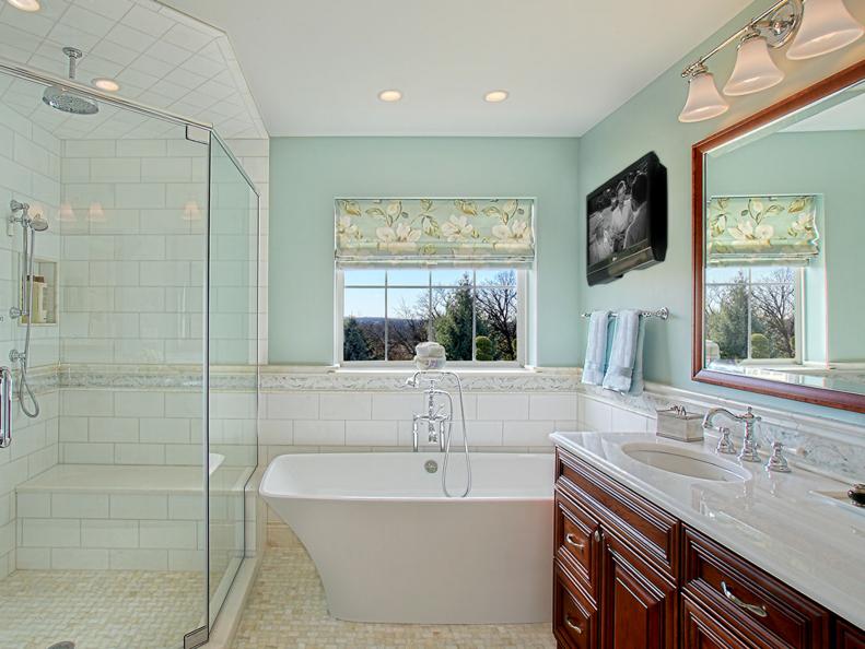 Blue Bathroom With Contemporary Tub and Glass Shower 