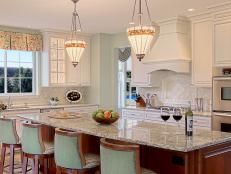 Transitional Kitchen With White Cabinets and Large Wooden Island 