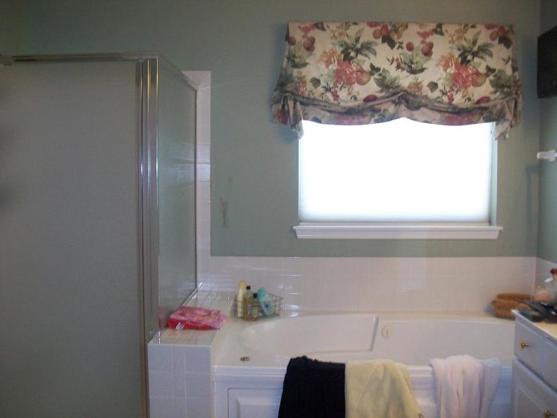 The before bathtub took up a lot of visual space, while the outdated valance on the window blocked natural light, making the room appear even smaller.