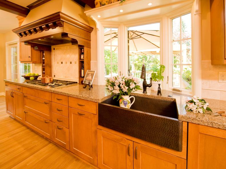 Transitional Kitchen With Wooden Accents and Copper Sink 
