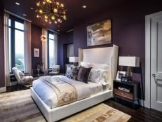 A color palette of plum purple, ivory and gold invites glitz and glamour into the main bedroom.