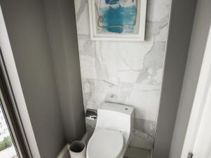 Toilet and Marble Tile Wall