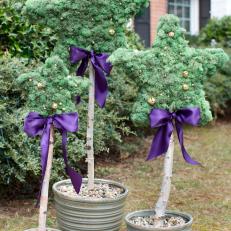 Star-Shaped Topiaries With Bells and Purple Bows