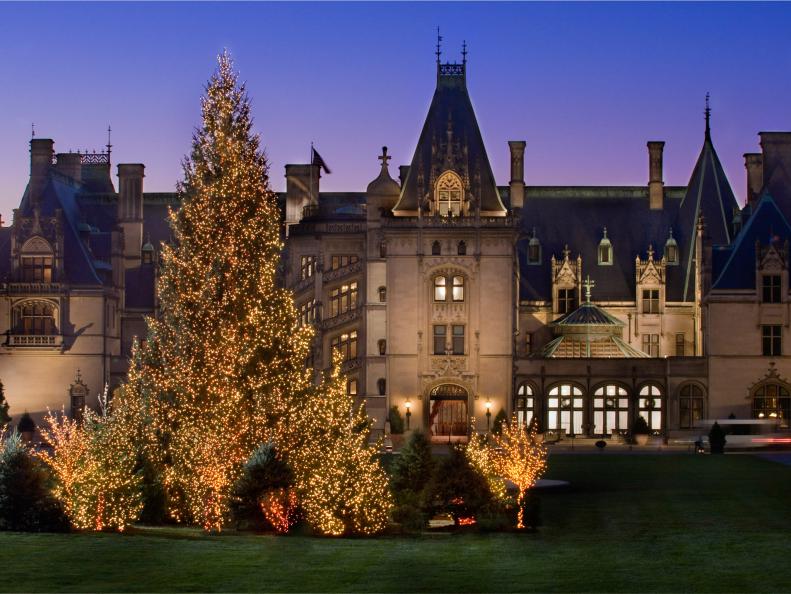 Biltmore House Facade at Night With Illuminated Christmas Trees