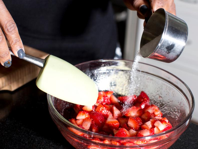 Mix powdered sugar into the strawberries