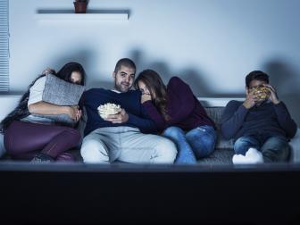 Young people watching TV and have fun at night