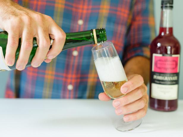 Pour 2 parts chilled champagne into flute.