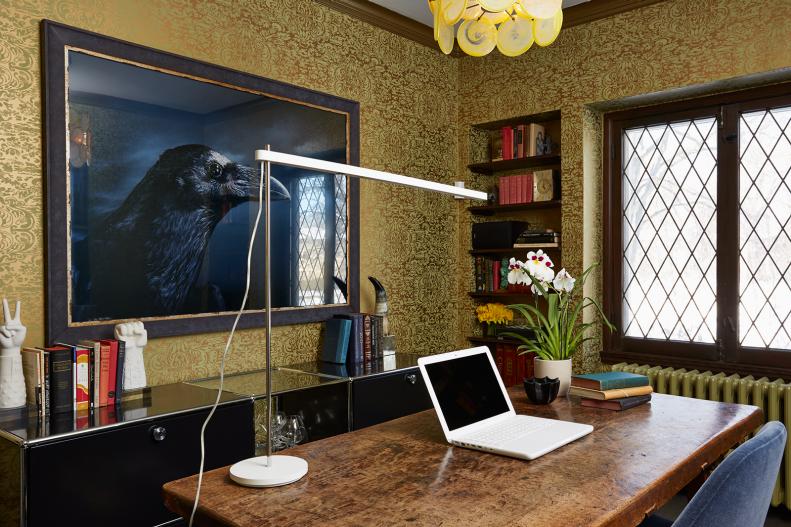 Gold Home Office With Wood Desk and Eagle Artwork