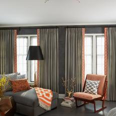 Eclectic Gray Bedroom With Fresh Orange Accents