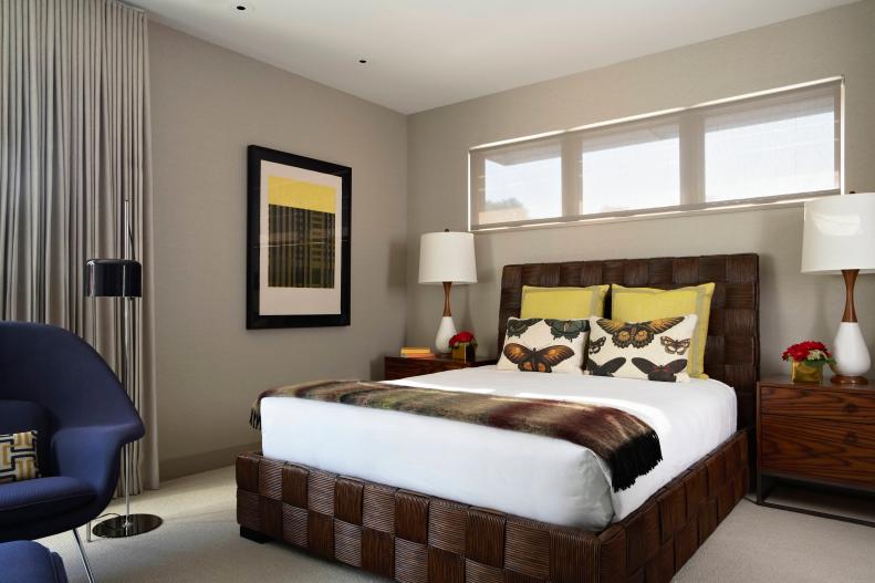 Contemporary Neutral Bedroom With Brown Bed and Yellow Accents