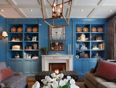 Blue Built-in Shelves & White Fireplace in Traditional Living Room