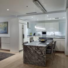 Gray and White Modern Open Plan Kitchen With Dining Table