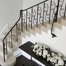 White Stairs With Curlicue Metal Railing