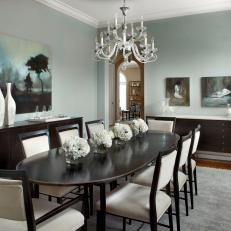 Gray and White Transitional Dining Room With Chandelier