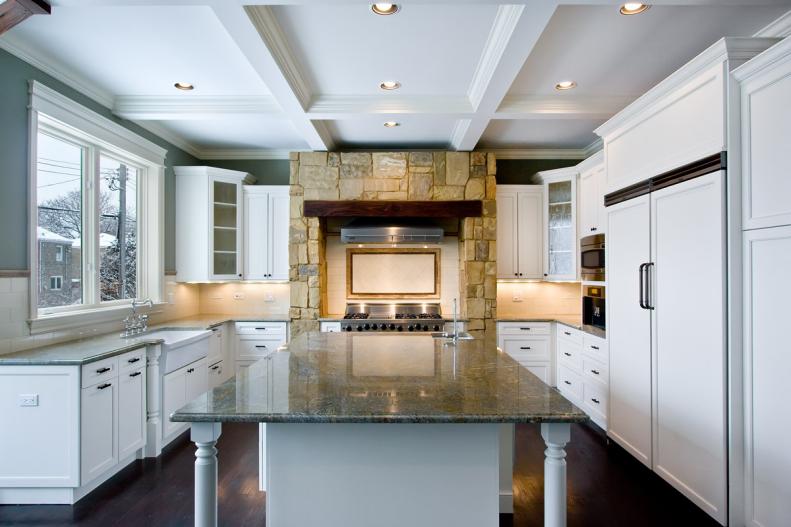 Gray Kitchen With Stone Stove Surround and Coffered Ceiling