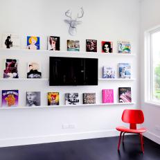 Gallery Wall With Pop Art Books and Red Chair
