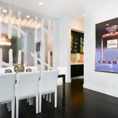 Modern White Dining Room With Chanel Artwork