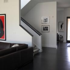 Brown and White Modern Foyer With Jackie O. Portrait